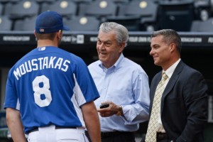 Mike Moustakas #8 of the Kansas City Royals talks with owner and Chief Executive Officer David Glass (C) and general manager Dayton Moore