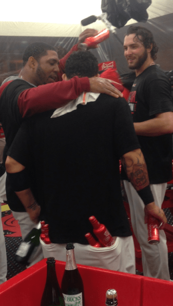 Oscar Tavares shares a moment with Yadier Molina after clinching NLDS.
